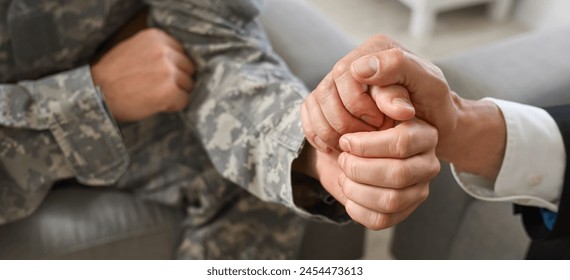 Psychologist calming soldier during psychotherapy session, closeup. Banner for National PTSD Awareness Day 