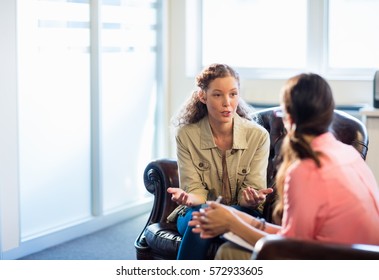Psychologist having session with her patient in office