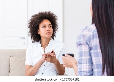 Psychologist listening to her patient and writing notes, mental health and counseling. Psychologist consulting and psychological therapy session concept - Powered by Shutterstock