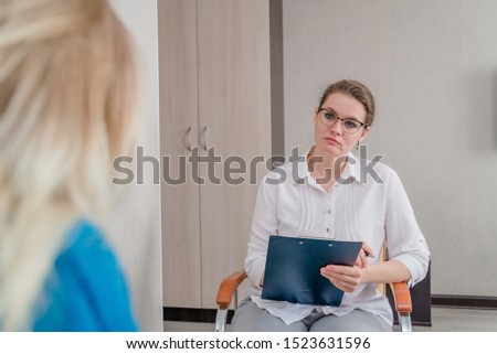 Similar – Female doctor talking to elderly patient in wheelchair