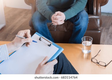 Psychologist Taking Notes During Psychotherapy Session