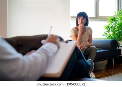 Psychologist Taking Notes During Therapy Session Stock Photo 1931601785 