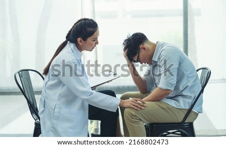 Psychologist woman talking and making notes to seek advice problems with young asian man