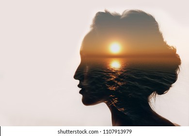 Psychology concept. Sunrise and dreamer woman silhouette.