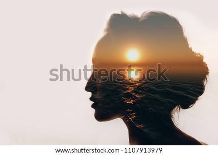 Psychology concept. Sunrise and dreamer woman silhouette.