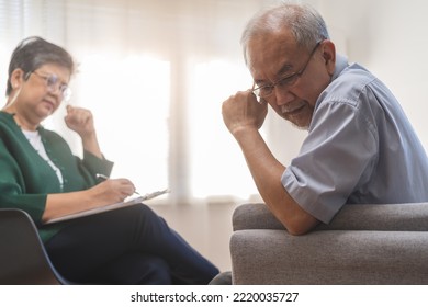 Psychology, Depression People. Elderly Asian Patient Man, Male Consult With Psychologist, Psychiatrist. Older Doctor Woman Consulting, Counseling Mental Health At Clinic. Encouraging, Therapy.