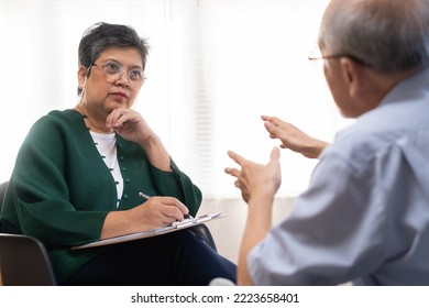 Psychology, Depression People. Elderly Asian Patient Man, Male Consult With Psychologist, Psychiatrist. Older Doctor Woman Consulting, Counseling Mental Health At Clinic. Encouraging, Therapy.