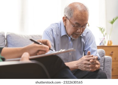 Psychology, depression people. Elderly asian patient man, male consult with psychologist, psychiatrist. Older doctor woman consulting, counseling mental health at clinic. Encouraging, therapy. - Powered by Shutterstock