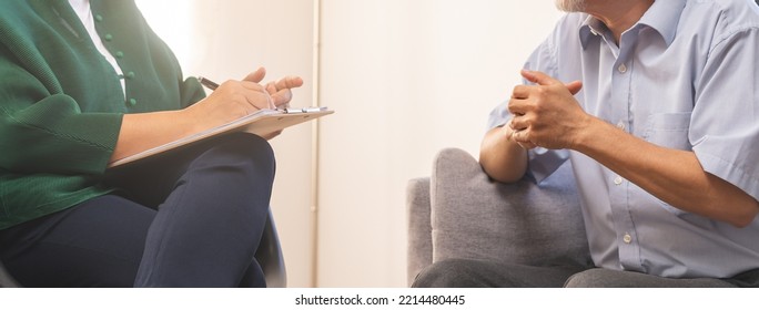 Psychology, Depression People. Hand Of Elderly Asian Patient Man, Male Consult With Psychologist, Psychiatrist. Older Doctor Woman Consulting, Counseling Mental Health At Clinic. Encouraging, Therapy