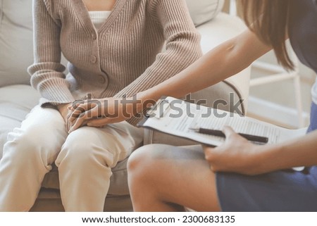 Psychology, depression. Sad, suffering asian young woman, consulting with psychologist, psychiatrist while patient counseling mental problem with doctor at clinic. Encouraging, therapy, health care.