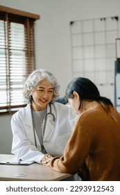 Psychology, depression. Suffering asian old woman, consulting with psychologist, psychiatrist while patient counseling mental problem. Encouraging, therapy, health care. in office - Shutterstock ID 2293912543