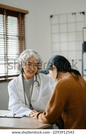 Psychology, depression. Suffering asian old woman, consulting with psychologist, psychiatrist while patient counseling mental problem. Encouraging, therapy, health care. in office
