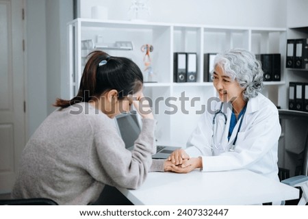 Psychology, depression. Suffering asian woman, consulting with psychologist, psychiatrist while patient counseling mental problem. Encouraging, therapy, health care. in  clinic.
