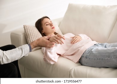 Psychotherapist and patient in office. Hypnotherapy session - Powered by Shutterstock