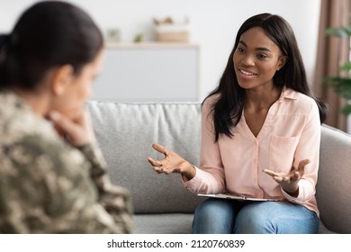 Psychotherapy Concept. Black psychologist lady talking to soldier woman during individual therapy, professional african american therapist counseling depressed military female, selective focus - Shutterstock ID 2120760839