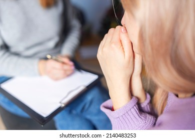 Psychotherapy session, a woman is talking with her psychologist at her office. Psychotherapy consultation. Selective focus. - Shutterstock ID 2140483253