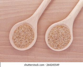 Psyllium Seed Husks In Wooden Spoons