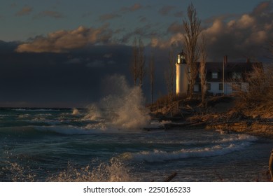 Pt. Betsie Lighthouse taken Spring of 2020 at sunset as a storm was moving across Lake Michigan. One of my favorite lighthouses in the Mitten and one of the more popular photographed lighthouses. - Shutterstock ID 2250165233