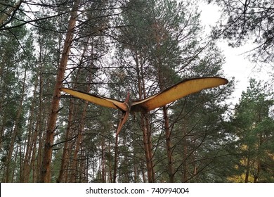 Pterodactyl flies in the forest.