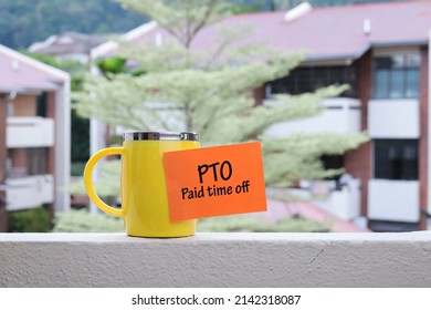 PTO, Paid Time Off Concept With Words, Mug And Housing Area As Background.