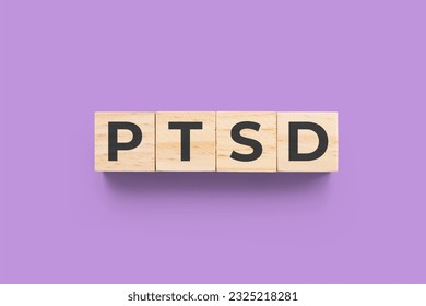PTSD (Post-Traumatic Stress Disorder) wooden cubes on purple bac - Shutterstock ID 2325218281