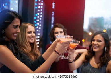 Pub, friends and group cheers with drink at party together for celebration, event or happy hour at night club. Toast, girls or women with alcohol glass at cocktail bar for social gathering with bokeh - Powered by Shutterstock