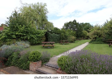 Pub Garden With Pub Benches And Greenery