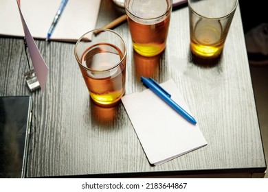 The pub quiz concept. Beer glass and blank paper for answers - Shutterstock ID 2183644867