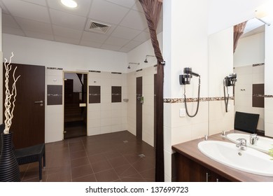 Public bathroom with a showers and sauna