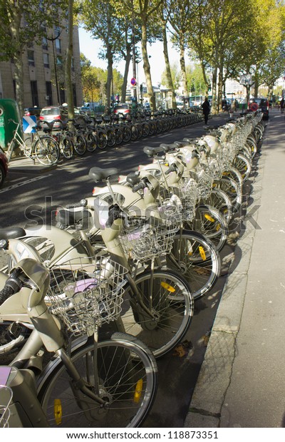 Public bike rental\
station on Paris alley