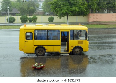 To Public Car Parks And Bus Stands.Pouring Heavy Rain.So Passengers Can't Get To The Bus.