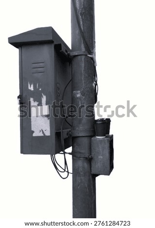 Public electrical panel located on the side of the road. full of advertising stickers and 2 used coffee cups.