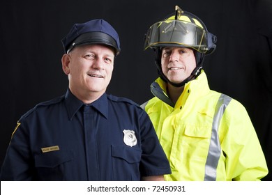 Public Employees, A Firefighter And A Police Officer, Smiling And Happy.  Black Background.