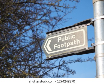 Public Footpath walking sign on a sunny day