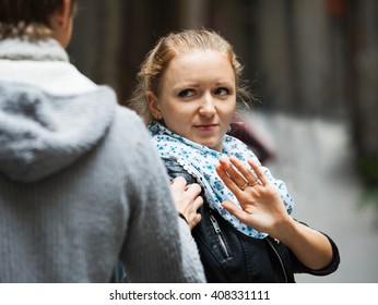 Public harassment: annoying young man chasing irritated girl  - Shutterstock ID 408331111