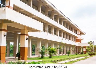 Public High School Building. View Of Secondary Or Primary School Architecture With Green Lawn With Playground In Thailand, Education Concept
