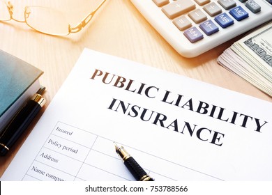 Public Liability Insurance Policy On An Office Desk.