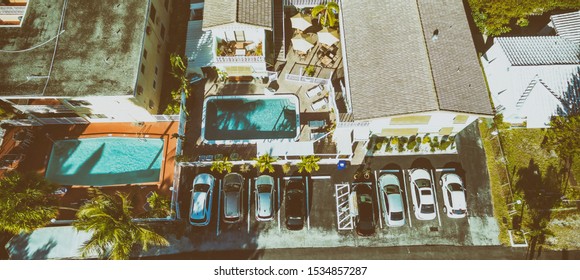 Public Parking With Homes And Pool, Aerial Overhead View.