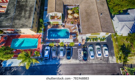 Public Parking With Homes And Pool, Aerial Overhead View.