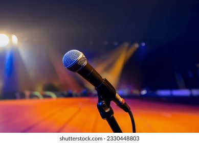 Public performance on stage Microphone on stage against a background of auditorium. Shallow depth of field. Public performance on stage. High quality photo