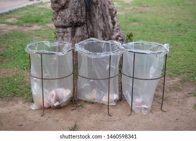 Public  Plastic Clear Bag Disposable Trash Bins On Songkhla Footpath In The Public Park With Transparent Removable Bin Bag Which Concealment Of Expensive.