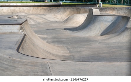 Public playground for a skateboard in a recreation park. No people.