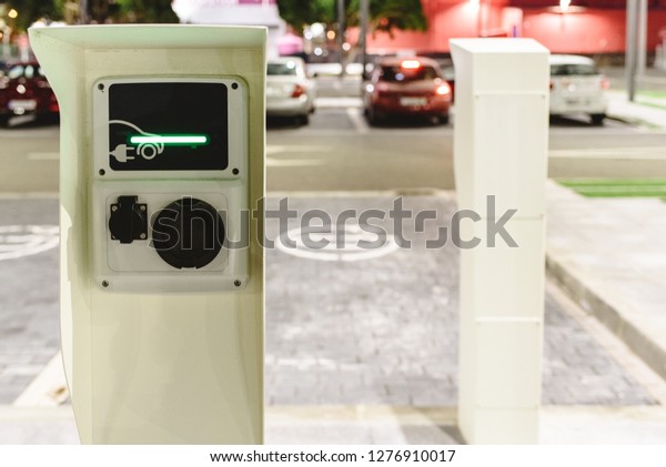 Public post charger of electric vehicles\
placed in the parking lot of a\
supermarket.