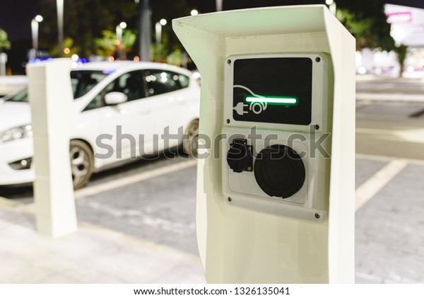 Public post charger of electric vehicles\
placed in the parking lot of a\
supermarket.