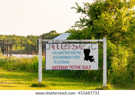 A public property sign welcoming travelers and tourists to the Southernmost point in Lousiana, known as the Gateway to the Gulf at the Mississippi River delta.