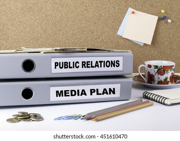 Public Relations And Media Plan - Two Folders On White Office Desk
