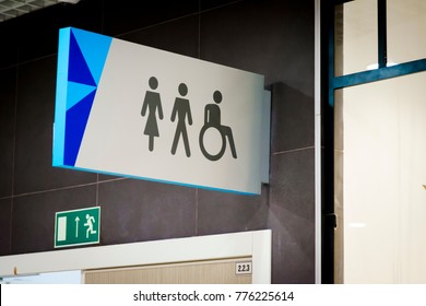 Public restroom signs with a disabled access symbol