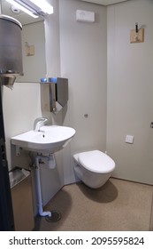 Public Restroom Sink And Toilet Onboard A Ferry In Norway.