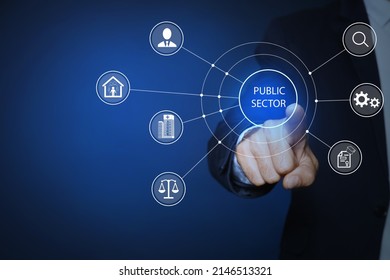 Public Sector Concept. Man Pointing At Virtual Screen With Different Icons On Blue Background, Closeup