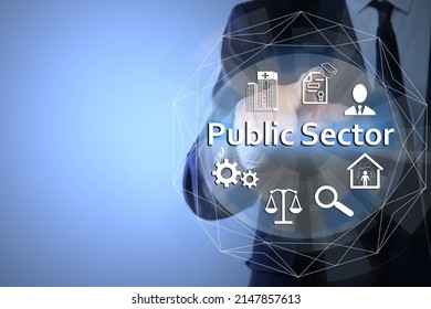 Public Sector Concept. Man Pointing At Virtual Screen With Different Icons On Light Blue Background, Closeup